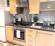 Fully equipped kitchen at Grand Central Deluxe Apartments