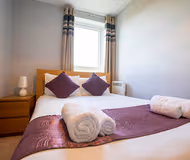 Luxury bedroom at New Central Apartment Woking