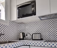 Fully equipped kitchen at Rue De Colisee Serviced Apartment, Champs Elysees