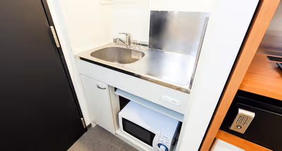 Simplistic living area in Awajimachi Apartments