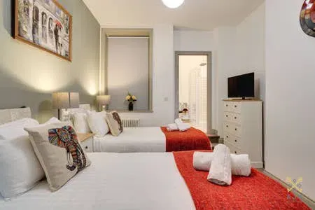 Bedroom at Queens Serviced Apartments