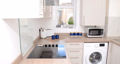 Fully equipped kitchen at 4 Bedroom Apartment in Stanwell Staines