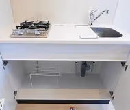 Simplistic living area in Maita Apartments